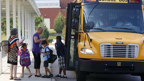 Students return for their first day of classes at Barwell Road Elementary School in Raleigh, N.C., on Monday.