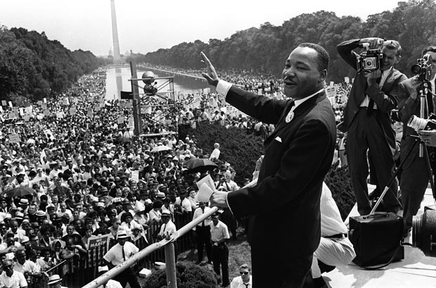 Civil rights leader Martin Luther King waves to a crowd estimated at 250,000 during his speech on the Mall in Washington DC during the ''March on Washington'' on Aug. 28, 1963. As he spoke, King envisioned a future of racial equality with his ''I Have a Dream'' speech. (AFP)