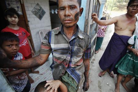 Soe Thein, a Buddhist mechanic, talks to Reuters reporters in Meikhtila