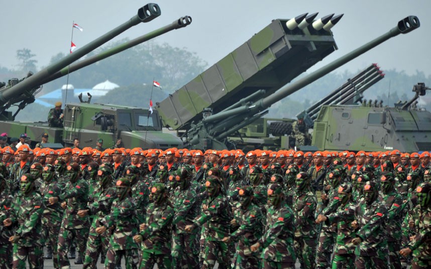 Indonesian military troops stand in form