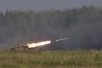 Russian Tornado-G multiple rocket launcher  drives during the Army-2015 show at a shooting range in Alabino, outside of Moscow, Russia, on Tuesday, June 16, 2015. Russias military this year alone will receive over 40 new intercontinental ballistic missiles capable of piercing any missile defences, President Vladimir Putin said Tuesday in a blunt reminder of the nations nuclear might amid tensions with the West over Ukraine. (AP Photo/Ivan Sekretarev)