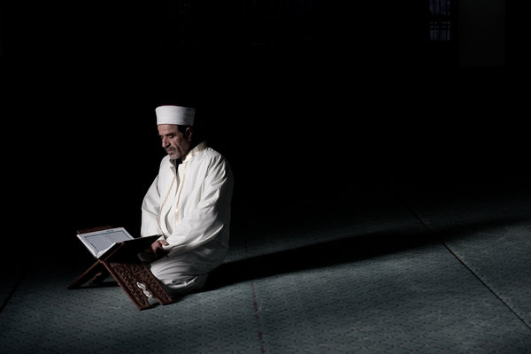Imam praying in mosque