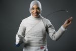 Fencer Ibtihaj Muhammad poses for photos at the 2016 Team USA Media Summit Wednesday, March 9, 2016, in Beverly Hills, Calif. (AP Photo/Damian Dovarganes)