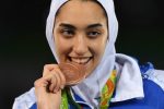 Iran's Kimia Alizadeh Zenoorin poses with her bronze medal on the podium after the womens taekwondo event in the -57kg category as part of the Rio 2016 Olympic Games, on August 18, 2016, at the Carioca Arena 3, in Rio de Janeiro. / AFP / Kirill KUDRYAVTSEV        (Photo credit should read KIRILL KUDRYAVTSEV/AFP/Getty Images)