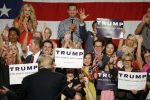 Republican presidential candidate Donald Trump turns around to supporters behind him as he speaks before a crowd of over 3,500 Saturday, July 11, 2015, in Phoenix. (AP Photo/Ross D. Franklin)