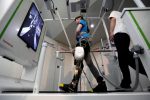 A model demonstrates Toyota Motor Corp's rehabilitation robot Welwalk WW-1000, designed to aid in the rehabilitation of individuals with lower limb paralysis, in Tokyo, Japan April 12, 2017. REUTERS/Toru Hanai