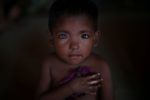 Hosne Ara, 4, a Rohingya refugee who fled Myanmar two-months ago listens to children singing at a children's centre in the Kutupalong refugee camp near Cox's Bazar, Bangladesh, November 5, 2017. REUTERS/Hannah McKay/File Photo      SEARCH "POY GLOBAL" FOR THIS STORY. SEARCH "REUTERS POY" FOR ALL BEST OF 2017 PACKAGES.    TPX IMAGES OF THE DAY