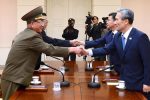South Korean National Security Adviser Kim Kwan-jin (R), South Korean Unification Minister Hong Yong-pyo (2nd R), Secretary of the Central Committee of the Workers' Party of Korea Kim Yang Gon (2nd L), and the top military aide to the North's leader Kim Jong Un Hwang Pyong-so (L), shake hands during the inter-Korean high-level talks at the truce village of Panmunjom inside the Demilitarized Zone separating the two Koreas, South Korea, in this picture provided by the Unification Ministry and released by Yonhap on August 22, 2015. Top aides to the leaders of North and South Korea met at the Panmunjom truce village straddling their border on Saturday, raising hopes for an end to a standoff that put the rivals on the brink of armed conflict. REUTERS/the Unification Ministry/Yonhap  ATTENTION EDITORS - NO SALES. NO ARCHIVES. FOR EDITORIAL USE ONLY. NOT FOR SALE FOR MARKETING OR ADVERTISING CAMPAIGNS. THIS IMAGE HAS BEEN SUPPLIED BY A THIRD PARTY. IT IS DISTRIBUTED, EXACTLY AS RECEIVED BY REUTERS, AS A SERVICE TO CLIENTS. SOUTH KOREA OUT. NO COMMERCIAL OR EDITORIAL SALES IN SOUTH KOREA. TPX IMAGES OF THE DAY.