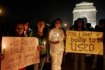 New Delhi : Volunteers of Better India participating in a candle light protest at India Gate in New Delhi on Tuesday condemning the gang rape of a 23-year-old student on a city bus. PTI Photo by Kamal Singh(PTI12_18_2012_000233B)