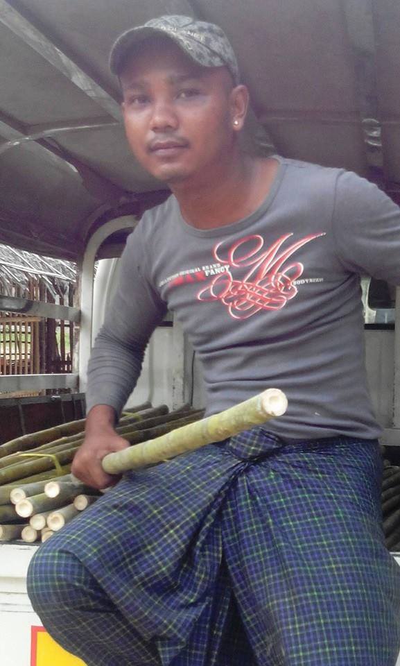 Nay Myo Wai’s thug member holding a bamboo stick