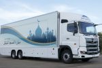 This July 23, 2018, photo provided by Mobile Mosque Executive Committee, shows Mobile Mosque, a mosque on wheels with the capacity for up to 50 people at Toyota Stadium in Toyota, western Japan. As Japan prepares to host visitors from around the world for the Summer Olympics in 2020, a Tokyo sports and cultural events company has created a mosque on wheels that its head hopes will make Muslim visitors feel at home. (Mobile Mosque Executive Committee via AP)